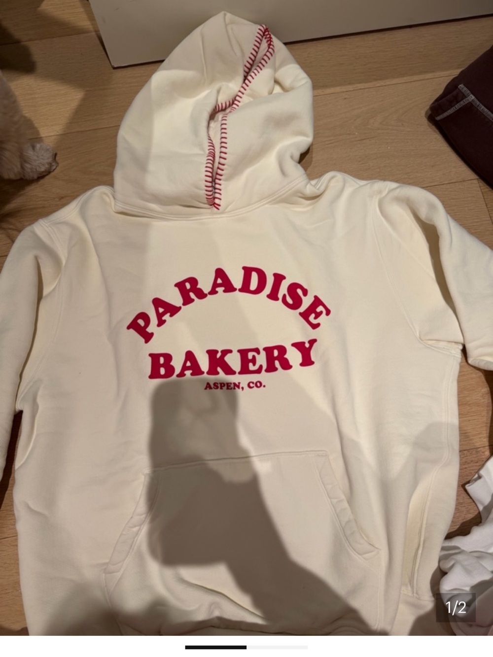 ASPEN Paradise Bakery Cream Hoodie with Red Logo - looking